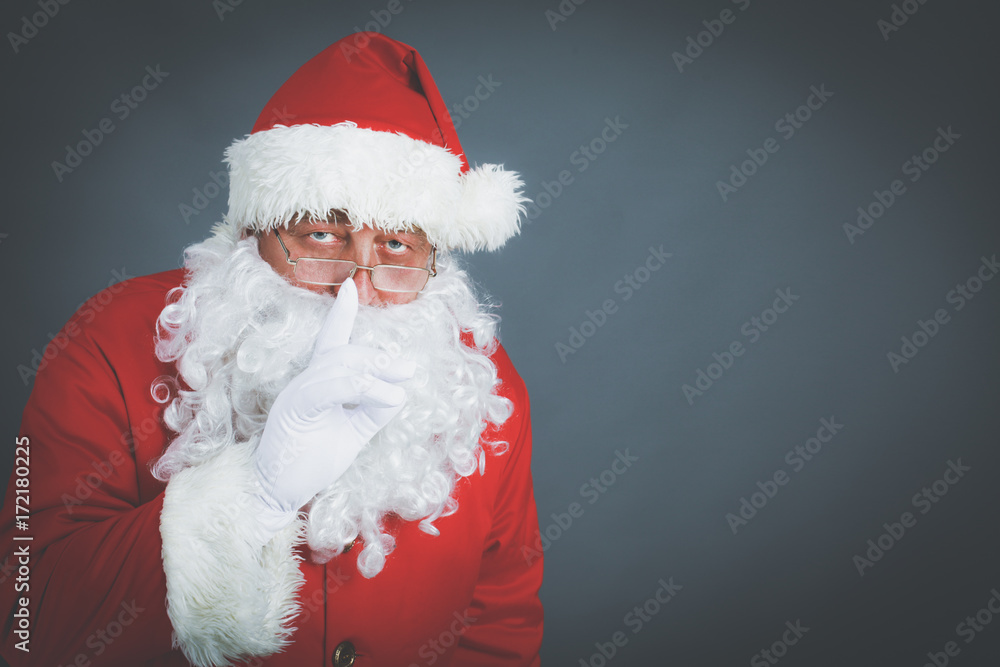 Real Santa Claus carrying big bag full of gifts, isolated on white background Real Santa Claus carrying big bag full of gifts, isolated on white background