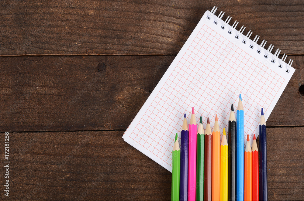 Notebooks and colored pencils Notebooks and colored pencils