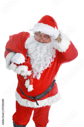 Real Santa Claus carrying big bag full of gifts, isolated on white background