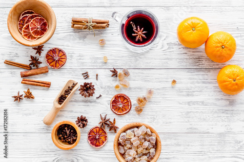 Celebrate new year winter evening with hot drink. Mulled wine or grog ingredients. White background top view.