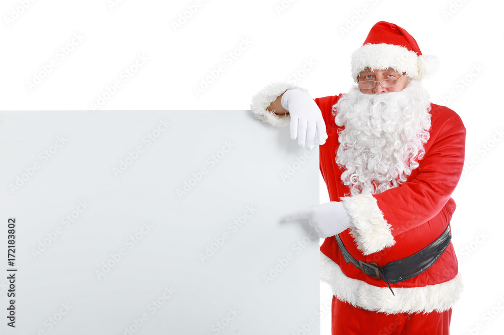 Happy Santa Claus looking out from behind the blank sign isolated on white background Happy Santa Claus looking out from behind the blank sign isolated on white background