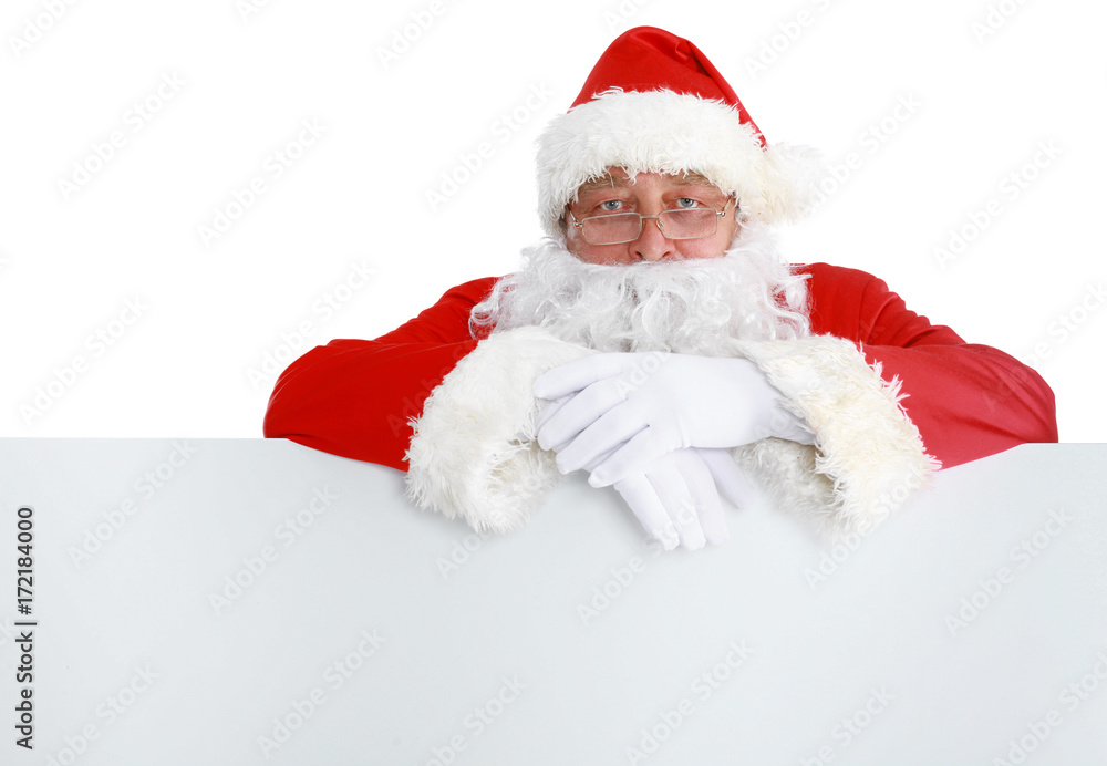 Happy Santa Claus looking out from behind the blank sign isolated on white background Happy Santa Claus looking out from behind the blank sign isolated on white background