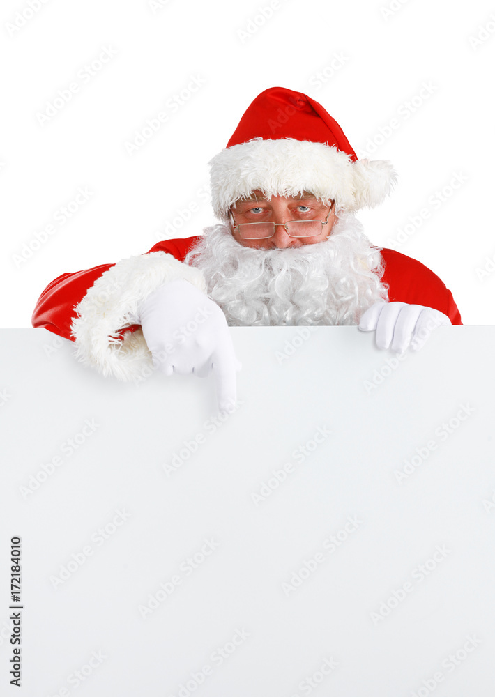 Happy Santa Claus looking out from behind the blank sign isolated on white background Happy Santa Claus looking out from behind the blank sign isolated on white background