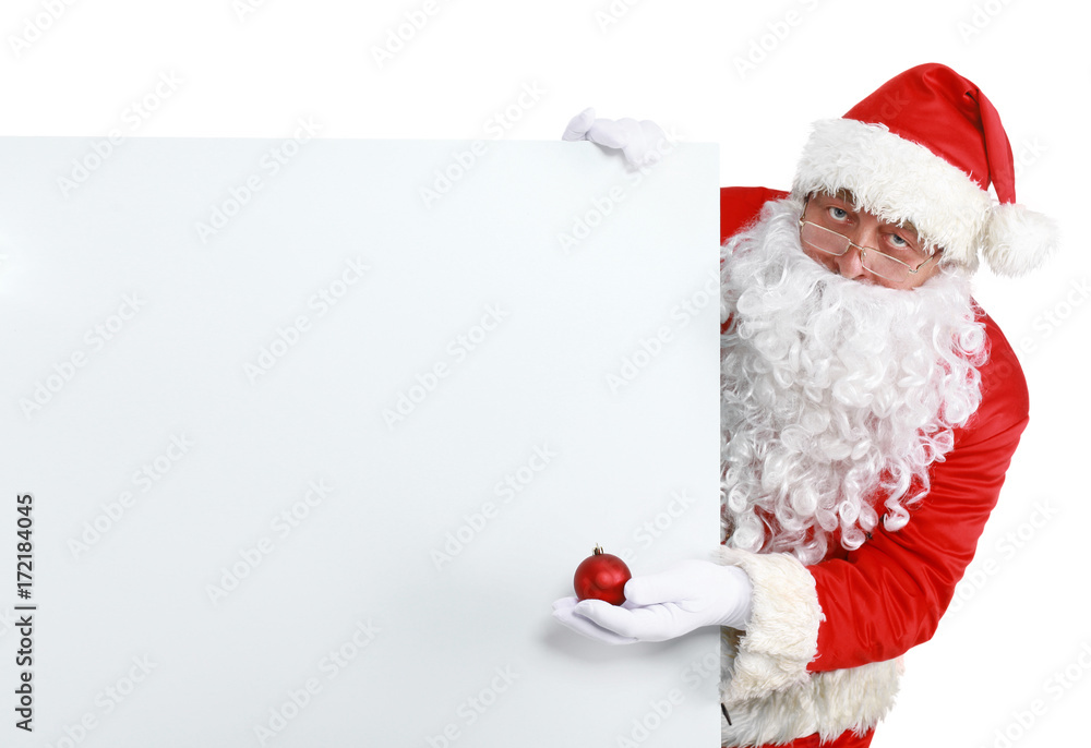 Happy Santa Claus looking out from behind the blank sign isolated on white background Happy Santa Claus looking out from behind the blank sign isolated on white background