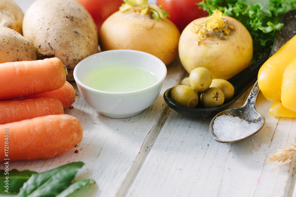 Vegetables, olives and spices over white wooden table. Vegetables, olives and spices over white wooden table.