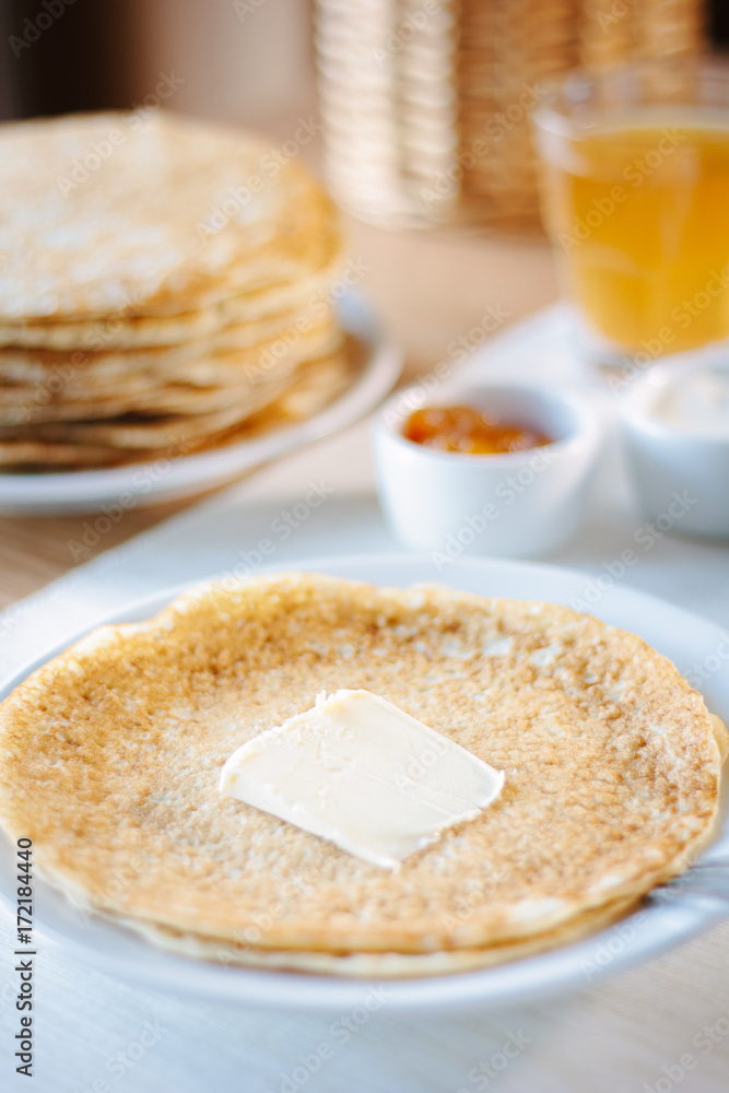 Russian pancakes with the butter on a restaurant.
