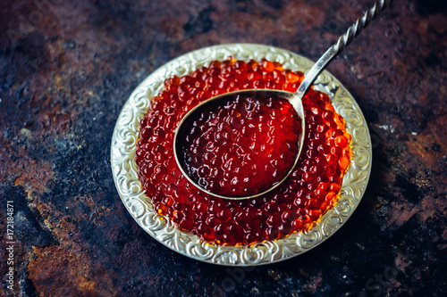 Red caviar in silver plate photo