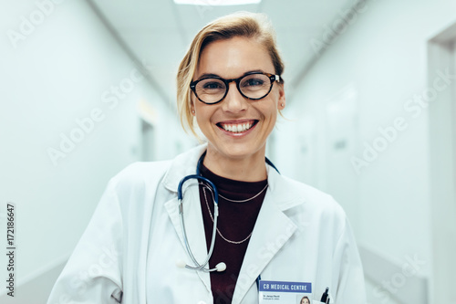 Fotografia, Obraz Female doctor standing in hospital corridor