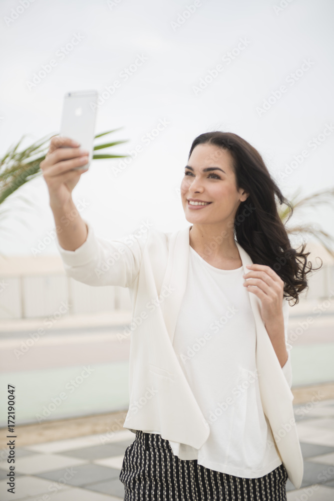 Woman communicating with cellphone