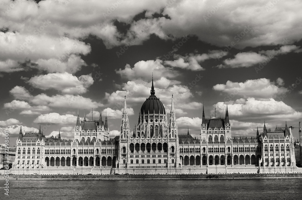 Hungarian Parliament on the embankment of Danube river in Budapest, Hungary. Black and white image