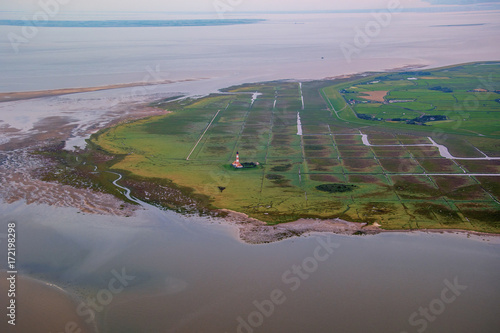 Panorama flight over the Elbe River and the west coast of Germany, with the Kiel-Canal and the Cities of Buesum and St. Peter-Ording photo