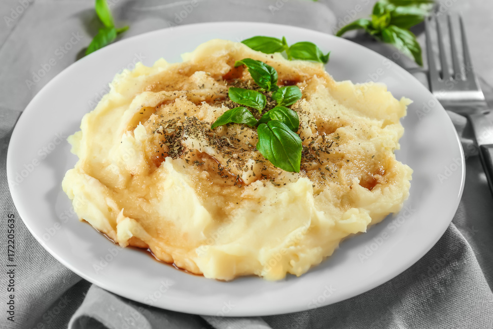 Plate with mashed potatoes on cloth