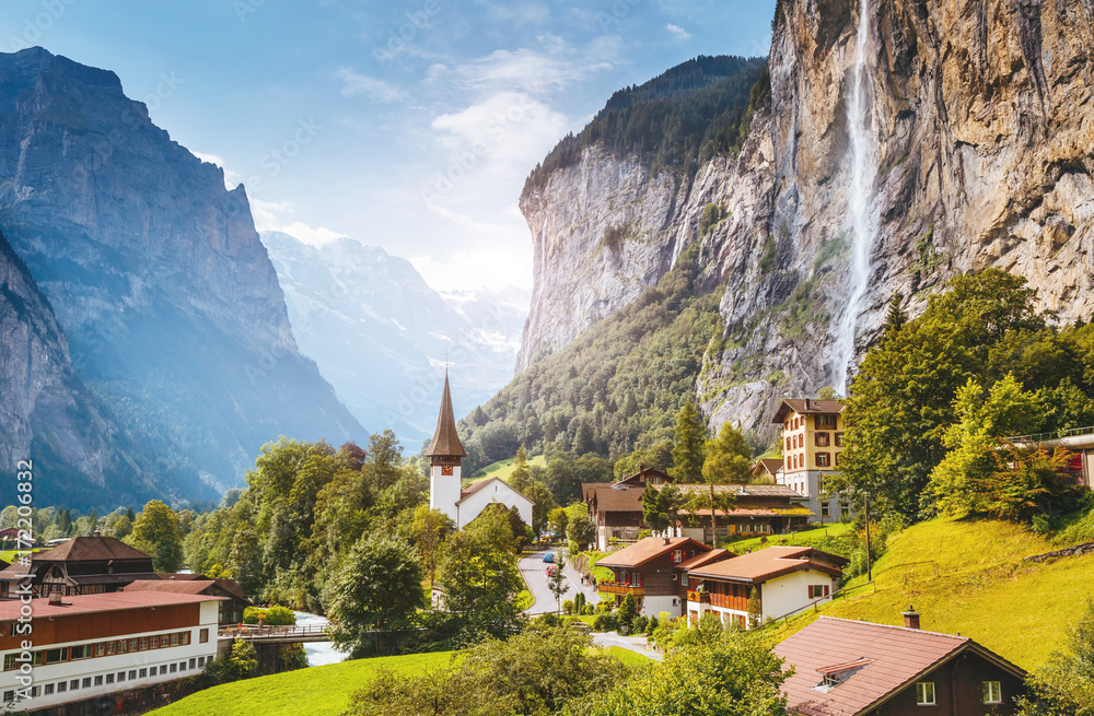 Majestic view of alpine village. Swiss alps, Lauterbrunnen valley, Staubbach waterfall, Europe. - obrazy, fototapety, plakaty 