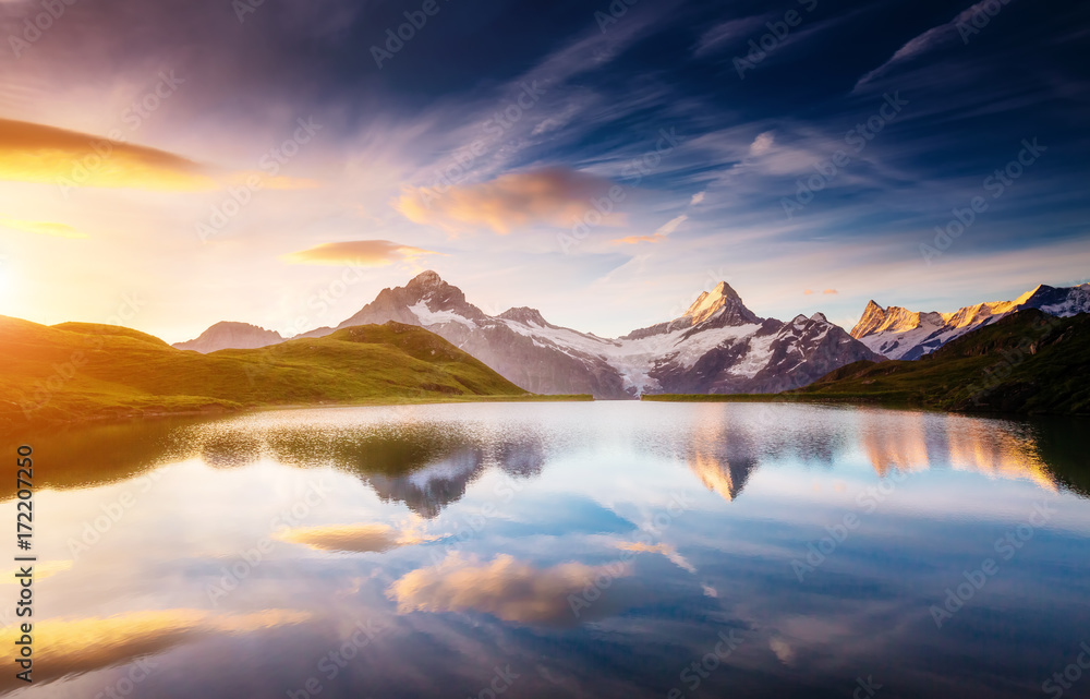 Fototapeta premium Great view of Mt. Schreckhorn and Wetterhorn above Bachalpsee lake. Grindelwald, Switzerland. Europe.