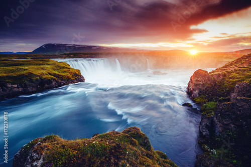 The rapid flow of water powerful Godafoss cascade. Location place Skjalfandafljot river, Iceland, Europe.