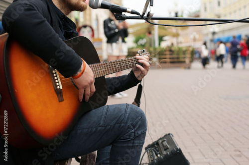 A street musician playing the guitar. photo