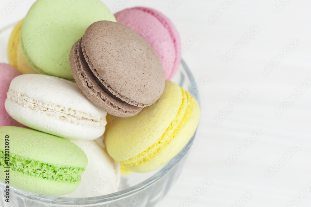 Different macaroons in a vase on the table Different macaroons in a vase on the table