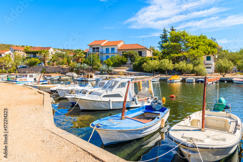 Fishing boats mooring in small bay near Primosten town, Dalmatia, Croatia