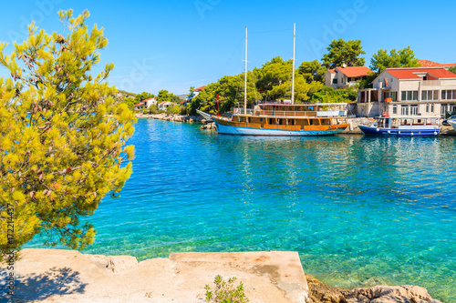 Tourist sailing boat anchoring in beautiful bay with turquoise sea water in Razanj port, Dalmatia, Croatia