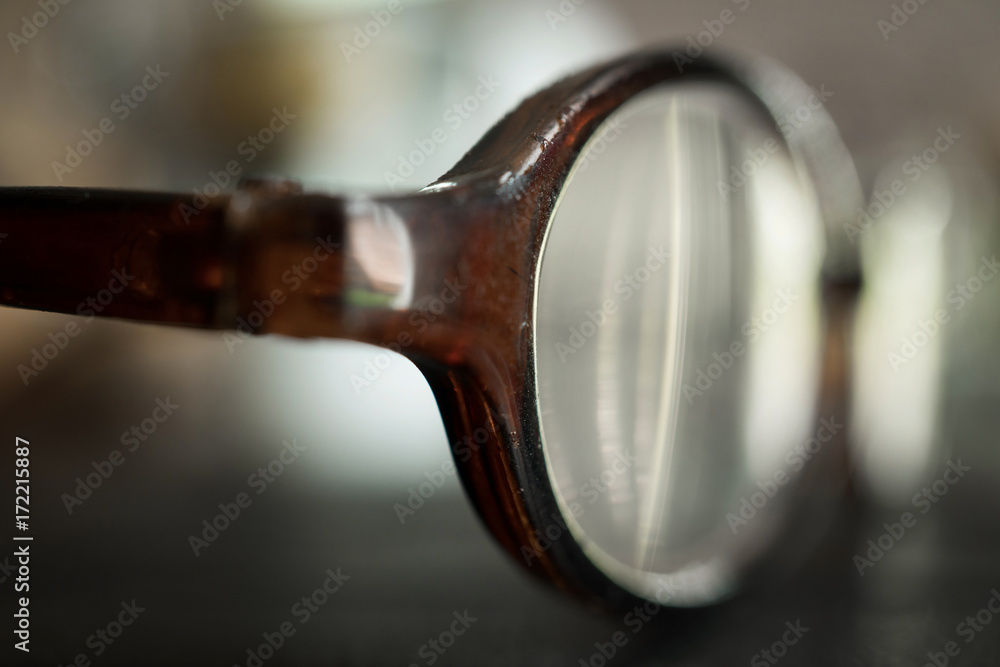 Closeup and Selective Focus of Old Eyeglasses on Table.