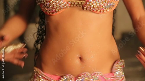 Bellydancer close up shine leather