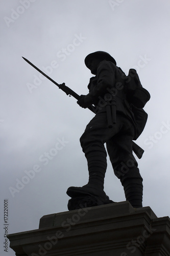 Silhouette of a British Tommy on the top of the war memorial in Portstewart in Conyu Londonderry, Northern Ireland