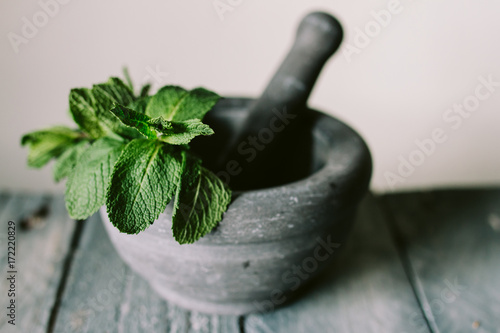 Fresh mint in a mortar and pestle
