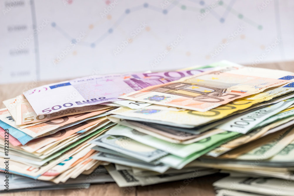dollar and euro banknotes - business graph. close up dollar and euro banknotes - business graph. close up