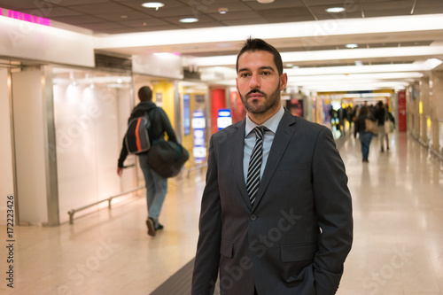 Wallpaper Mural Businessman walking in a station Torontodigital.ca