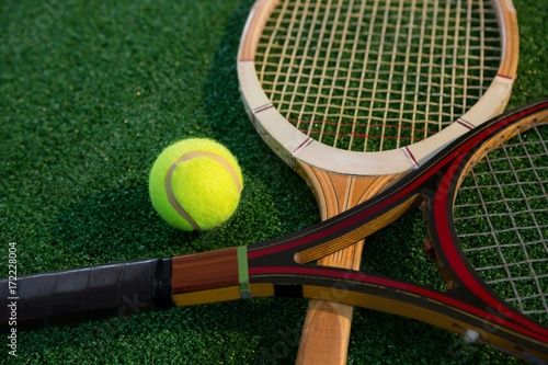 Close up of wooden racket with tennis ball © WavebreakMediaMicro