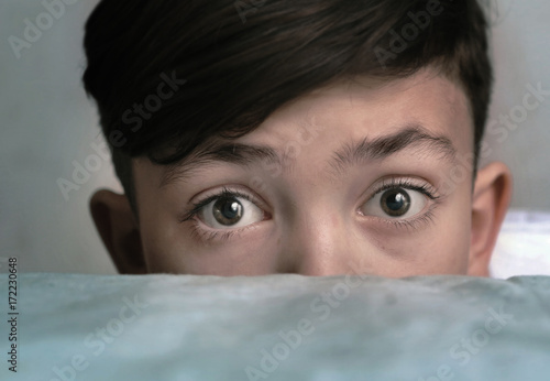 Canvas Print teenager handsome boy look over the shirm close up portrait