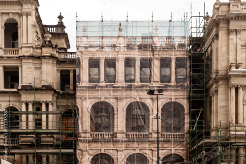 contruction of an old building, with printed scaffold sheeting