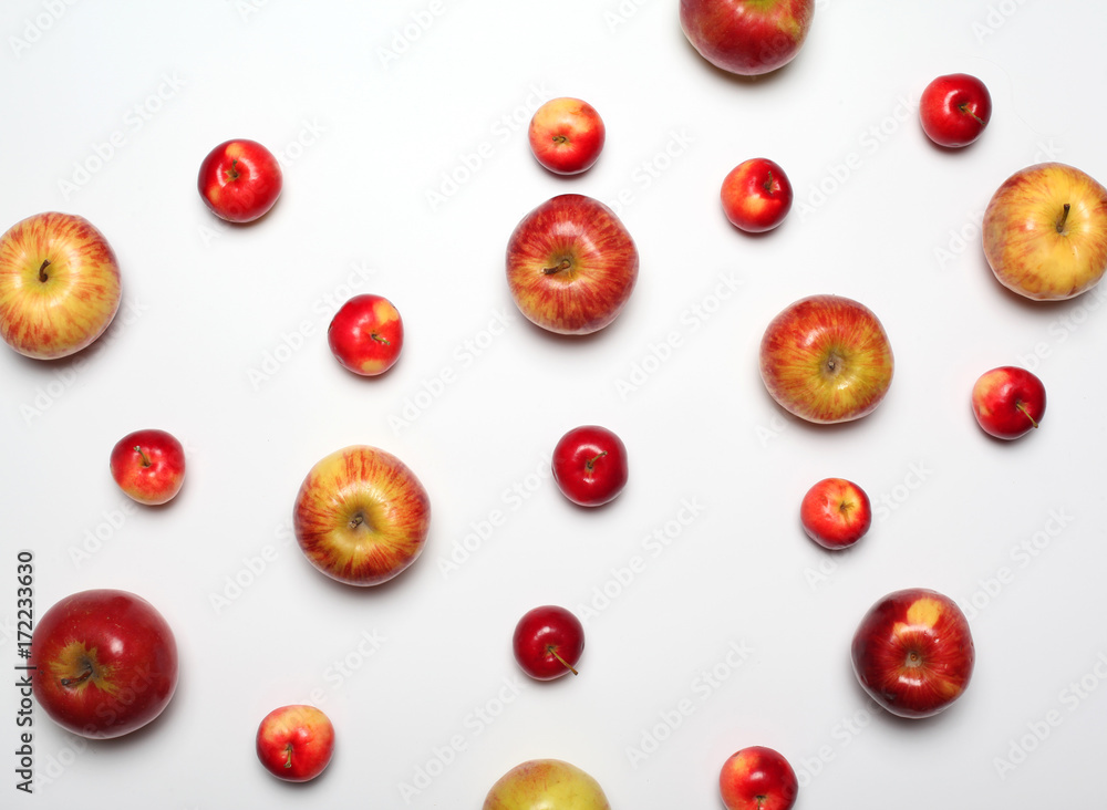 Many apples fruits on a white background, flat lay, empty copy space Many apples fruits on a white background, flat lay, empty copy space