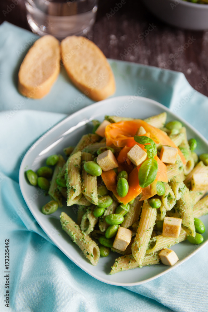 Pasta with pesto, edamame beans, tofu and carrots Pasta with pesto, edamame beans, tofu and carrots