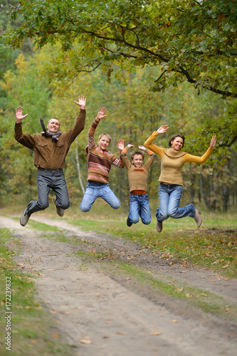 family in autumn forest