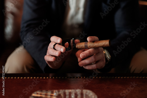 Close up of a Man Preparing to Light Up Cuban Cigar