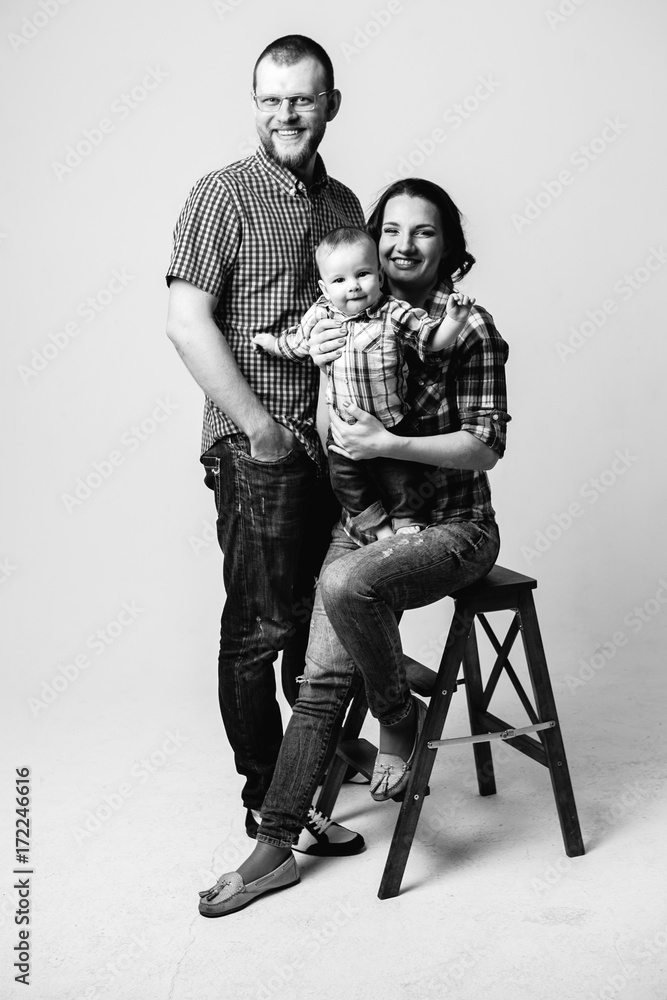 black and white portrait of a family with a baby boy black and white portrait of a family with a baby boy