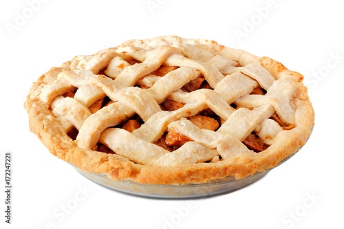 Homemade apple pie with lattice pastry isolated on a white background, side view