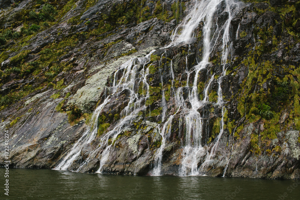 waterfall at Milford Sound, New Zealand waterfall at Milford Sound, New Zealand