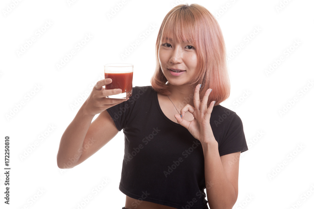 Young Asian woman show OK with tomato juice. Young Asian woman show OK with tomato juice.