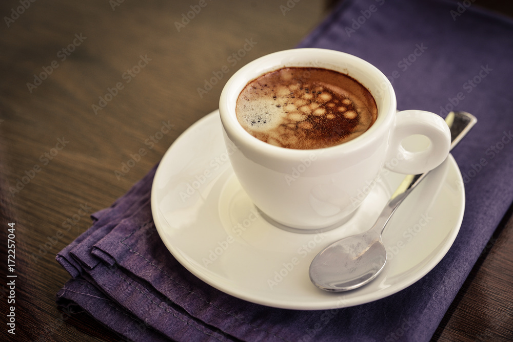 Espresso coffee in small white cup