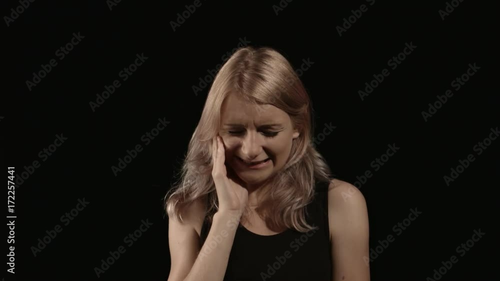 Cheerless woman having toothache Cheerless woman having toothache