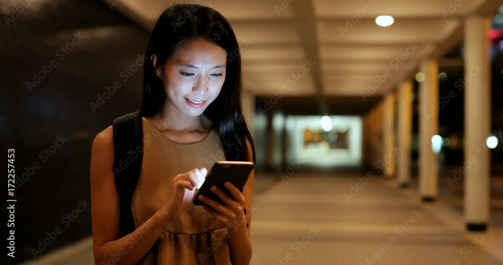 Woman use of mobile phone in city Woman use of mobile phone in city