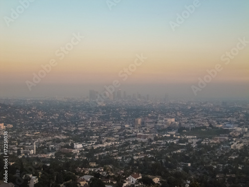 Cityscape or skyline of the LA city with smog during sunrise or sunset in Los Angeles © Andriy Blokhin