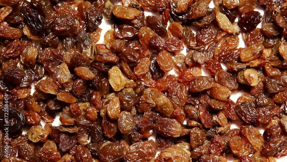 Raisin dried grape after washing are drying on paper tissue, background texture. Healthy food organic nutrition. Dolly slider shot 4K ProRes HQ codec Raisin dried grape after washing are drying on paper tissue, background texture. Healthy food organic nutrition. Dolly slider shot 4K ProRes HQ codec