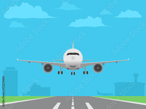 White plane landing on runway. Airport buildings