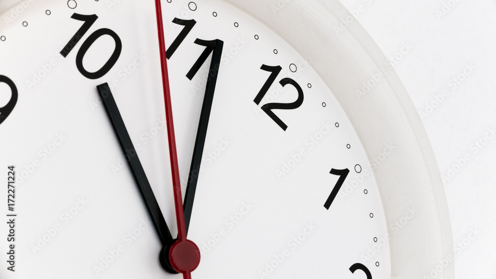 Closeup clock ticking showing ten hours