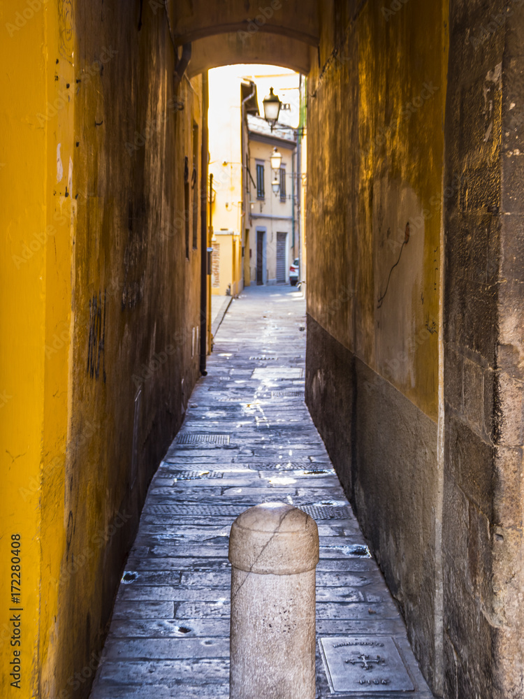 Small lane in the historic district of Pisa Small lane in the historic district of Pisa