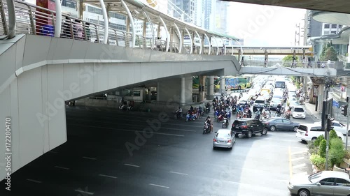 Traffic and the skywalk at Sathon District in Bangkok Thailand photo