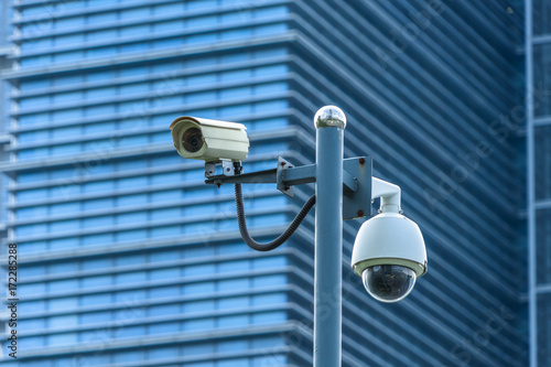 close-up view of security camera, in front of office building..